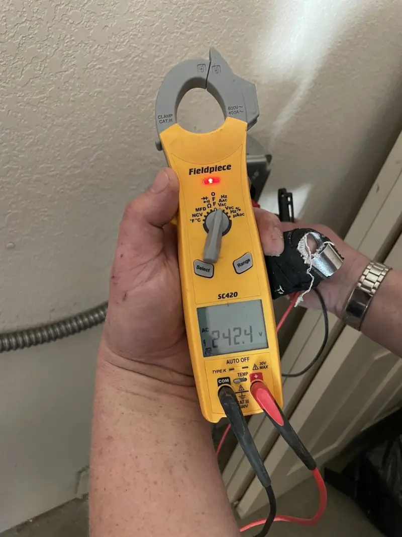 Voltage testing with clamp meter during Ceiling Fan Installation in Milford